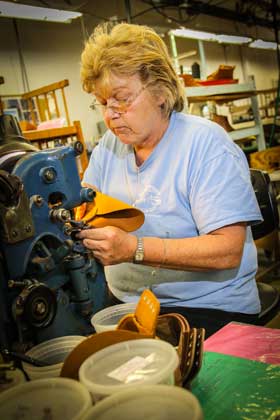 Rancourt & Co. employee working on a machine.