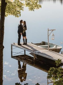 Couple on dock at Wolf Cove Inn - LA Metro Magazine