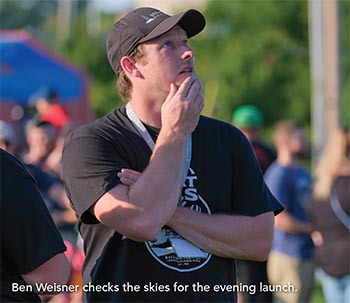 Balloon Meister, Ben Weisner checking skies for evening launch at great falls balloon fest