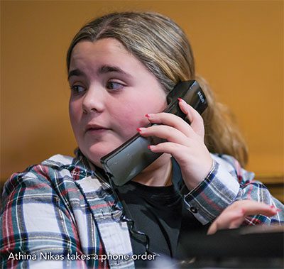 Taking a phone order at Village Pizzeria Mechanic Falls Maine